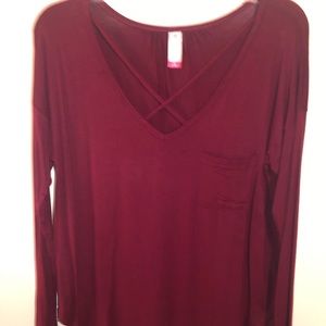 Burgundy long sleeve shirt.